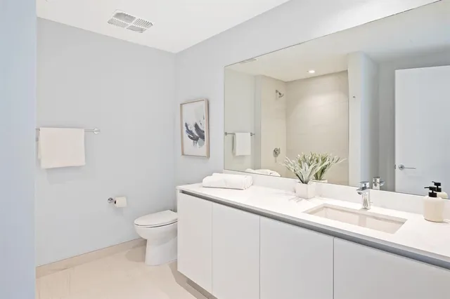 a utility room with sink dryer and washer