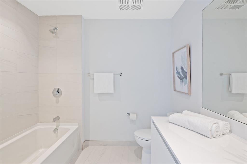 1116 North Ocean Boulevard, Unit 1606 Pompano Beach, FL 33062 - Photo 24 of 83 a bathroom with a toilet and a bath tub