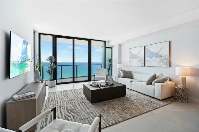 a living room with furniture and a large window