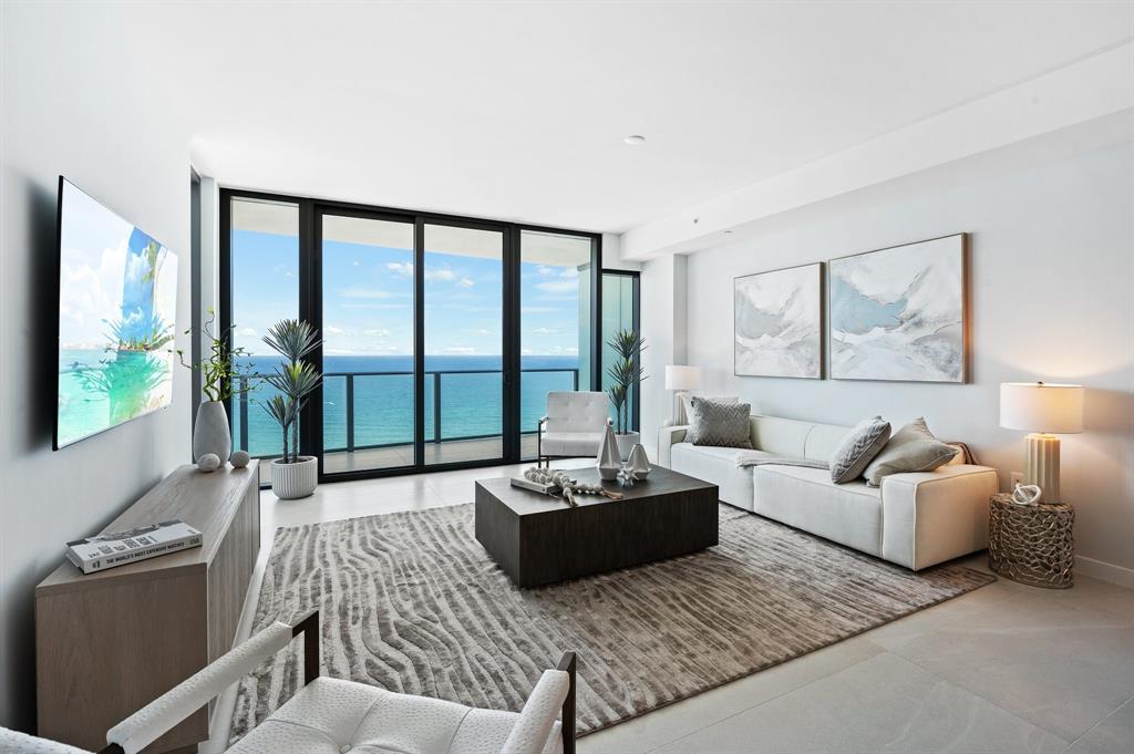 1116 North Ocean Boulevard, Unit 1606 Pompano Beach, FL 33062 - Photo 3 of 83 a living room with furniture and a large window