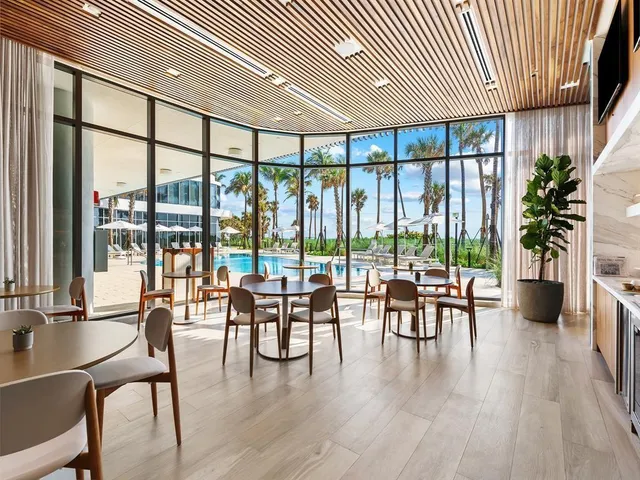 a view of a kitchen with a table and chairs