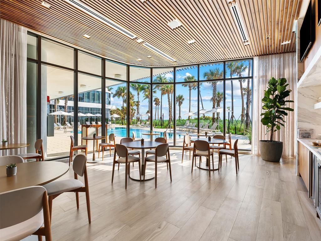 1116 North Ocean Boulevard, Unit 1606 Pompano Beach, FL 33062 - Photo 35 of 83 a view of a livingroom with furniture and floor to ceiling window