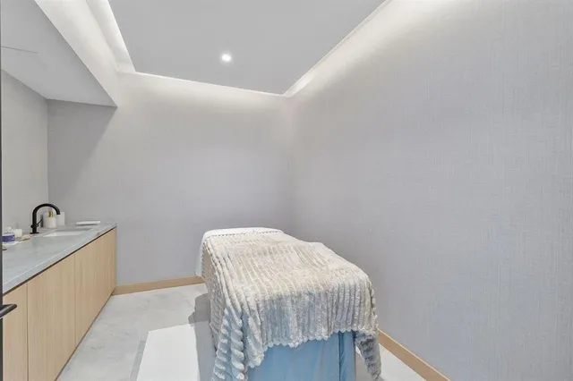 a view of swimming pool with outdoor seating and plants