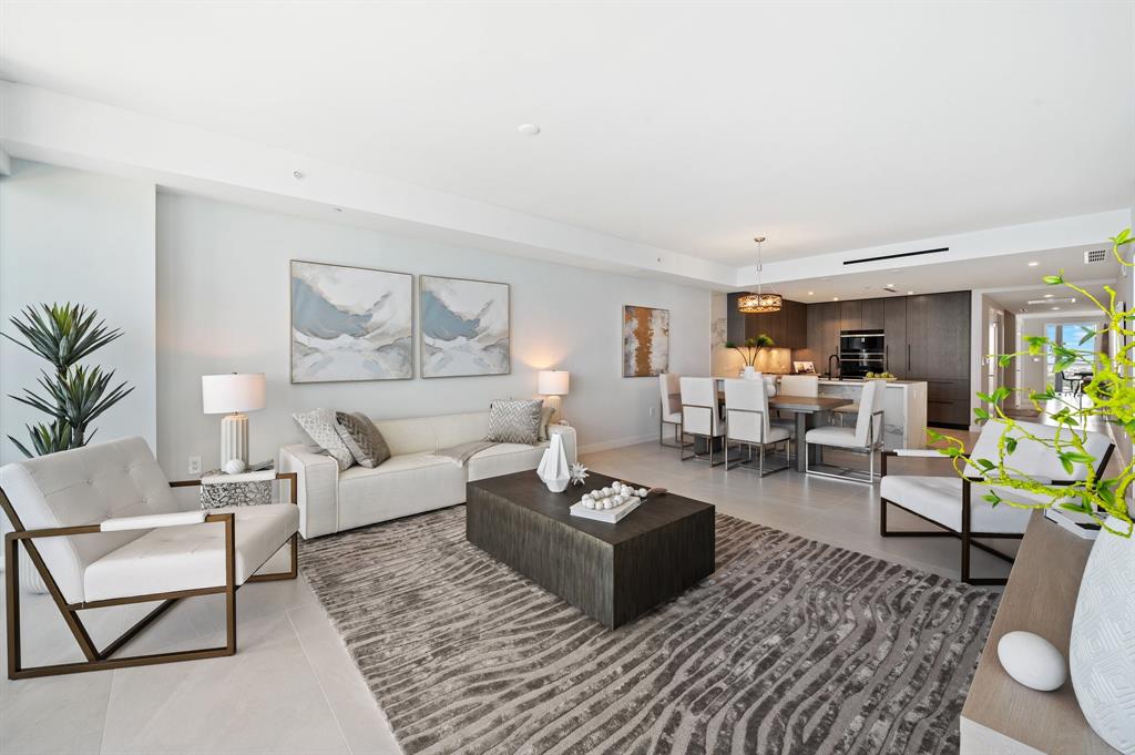 1116 North Ocean Boulevard, Unit 1606 Pompano Beach, FL 33062 - Photo 6 of 83 a living room with furniture wooden floor and a large window