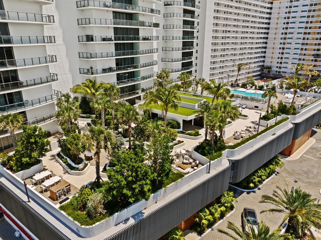 1116 North Ocean Boulevard, Unit 1606 Pompano Beach, FL 33062 - Photo 75 of 83 a view of a garden with an outdoor seating
