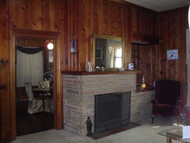 1030 Cross Link Road Raleigh, NC 27610 - Photo 4 of 4 a view of a livingroom with furniture and a fireplace