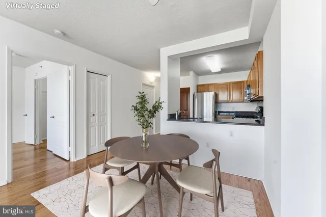 a view of a dining room with furniture and wooden floor