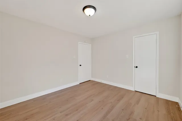 a view of room with wooden floor