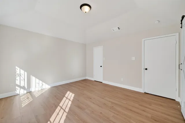a view of a livingroom with wooden floor
