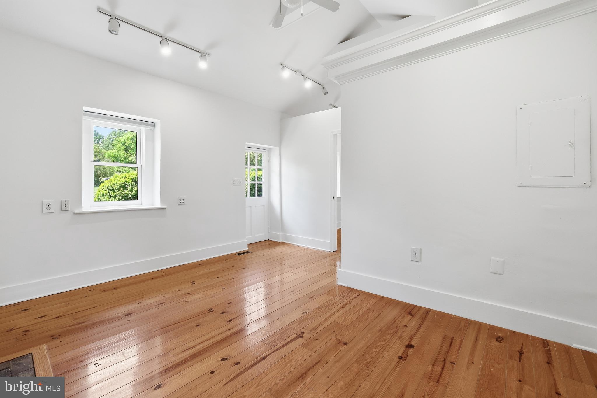 17781 Roxbury Hall Road Leesburg, VA 20175 - Photo 68 of 107 an empty room with wooden floor and window