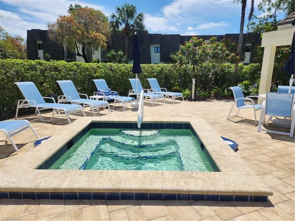 a view of a swimming pool with a patio