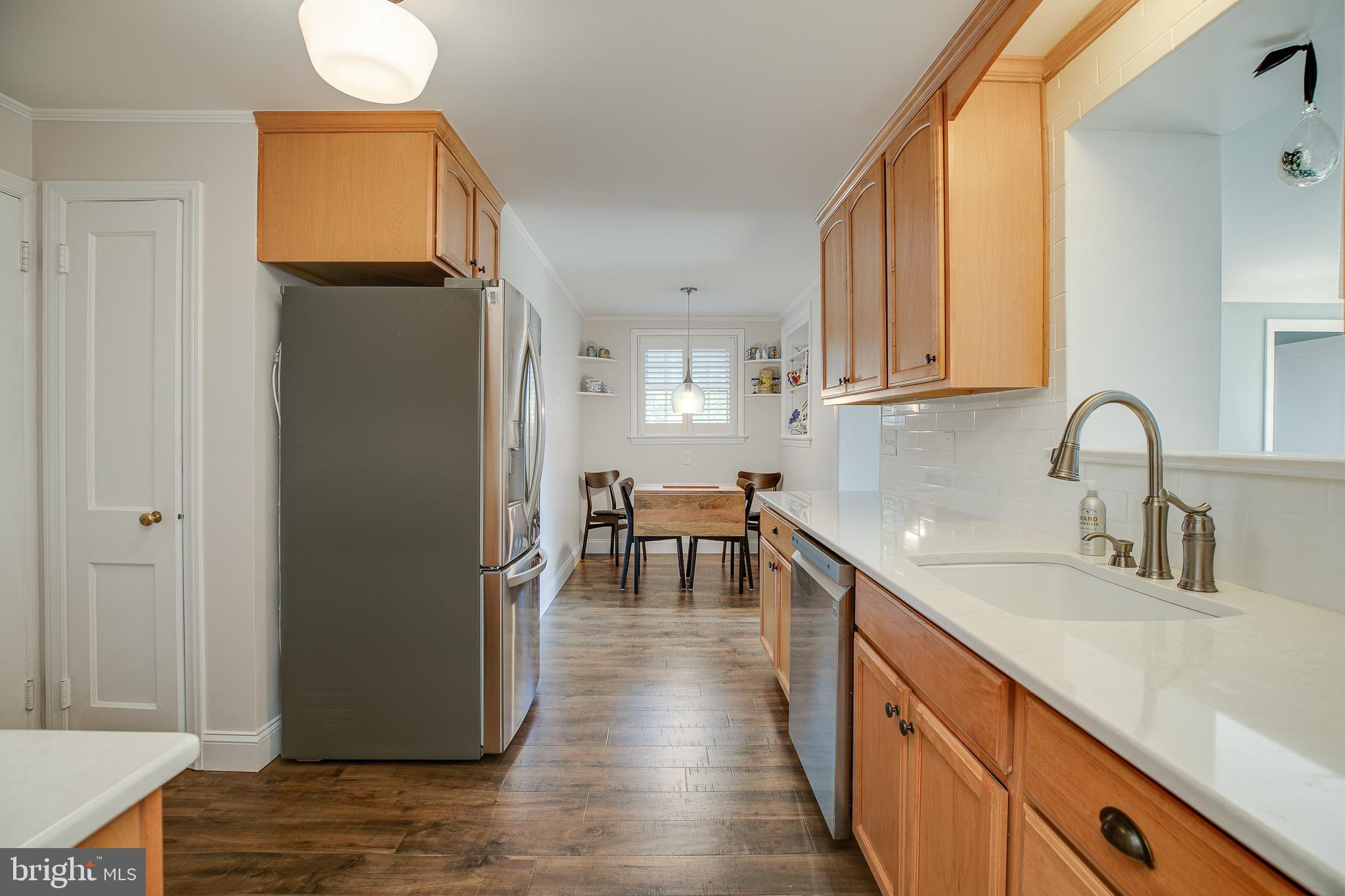 330 Old Lancaster Road Devon, PA 19333 - Photo 11 of 31 a kitchen with stainless steel appliances granite countertop a sink a stove and a refrigerator