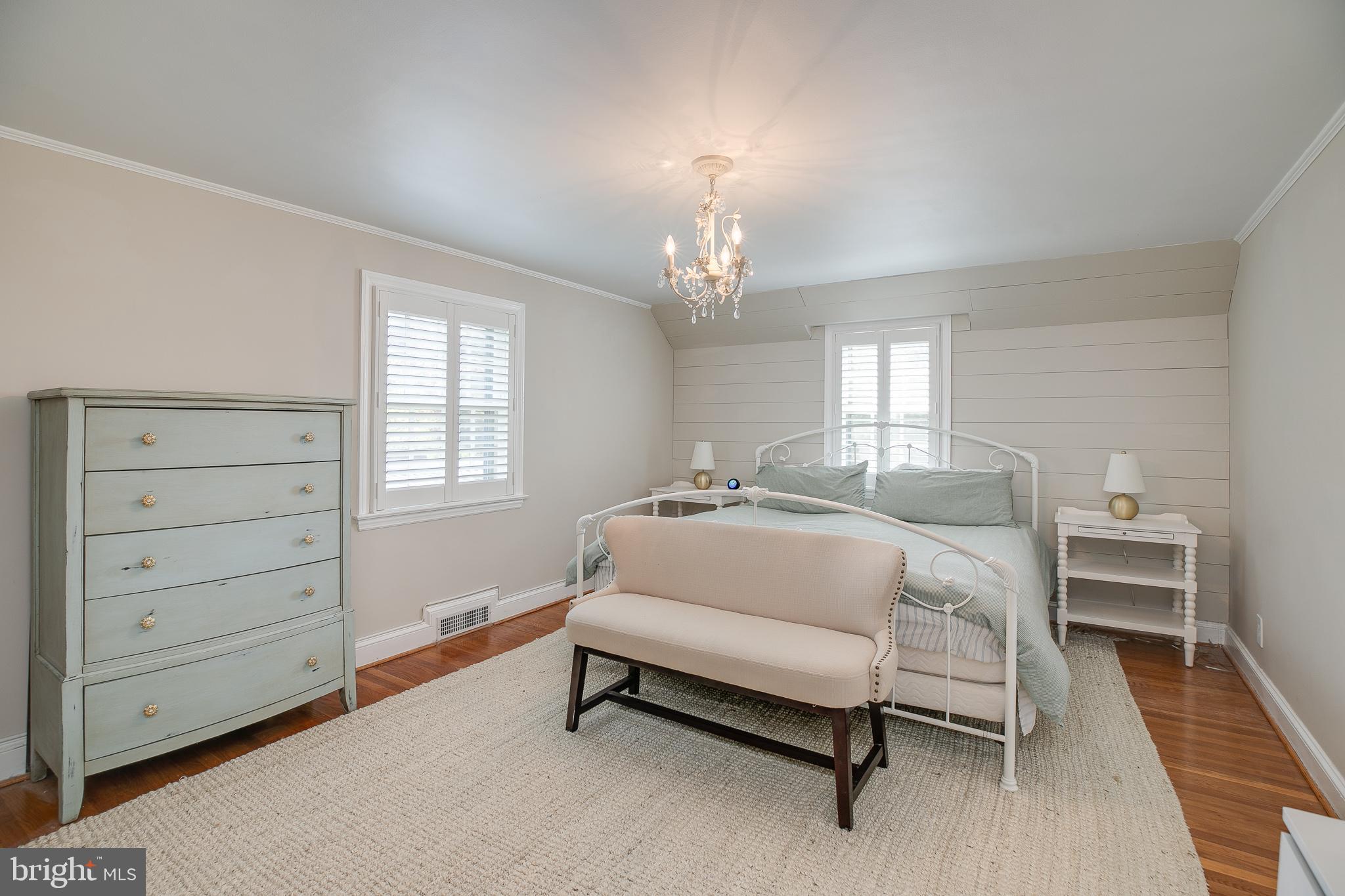 330 Old Lancaster Road Devon, PA 19333 - Photo 21 of 31 a spacious bedroom with a bed and a table