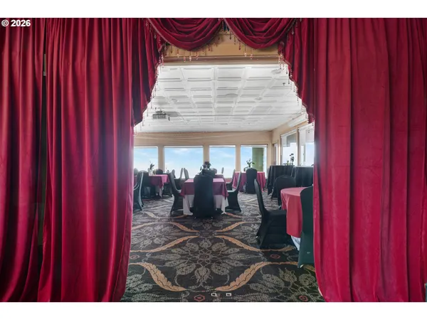a view of a patio with table and chairs