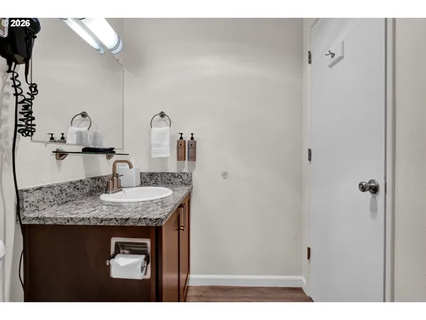 a view of bathroom with dual sinks