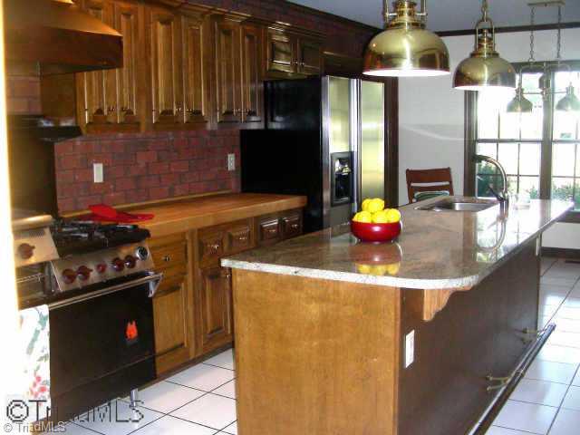 4811 New Sharon Church Road Hillsborough, NC 27278 - Photo 7 of 9 Other. The kitchen includes a Wolf stove and island with granite countertops