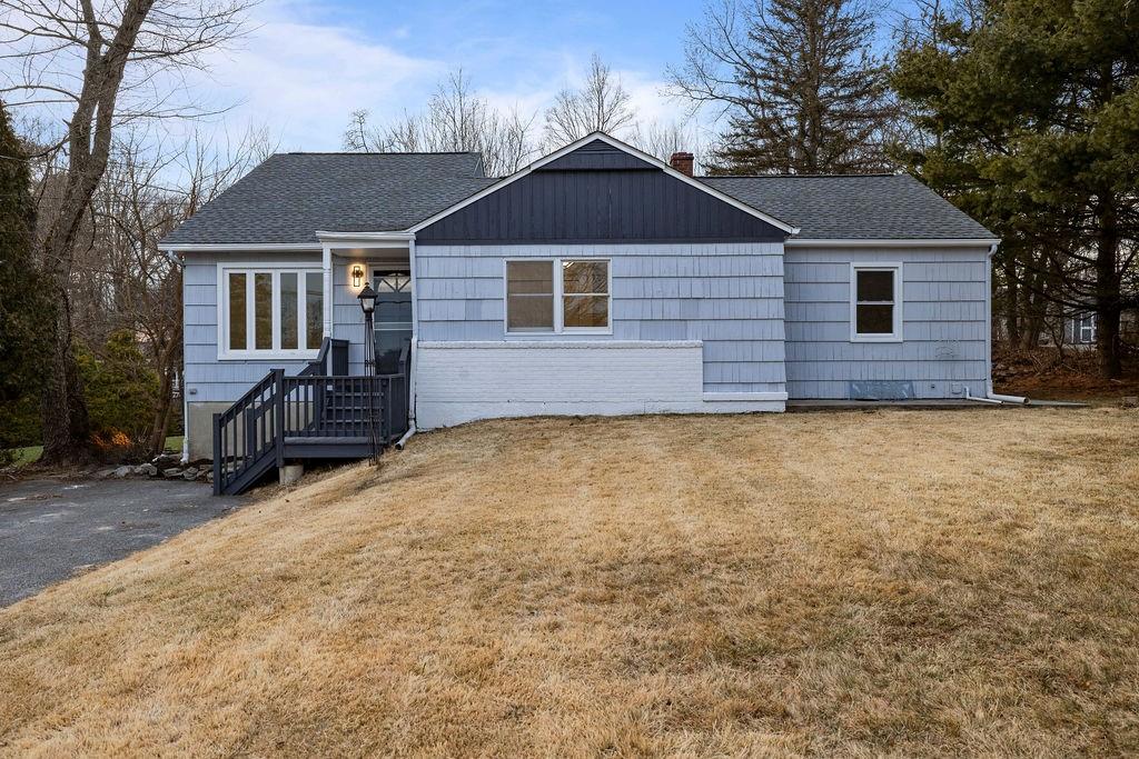 a front view of a house with a yard