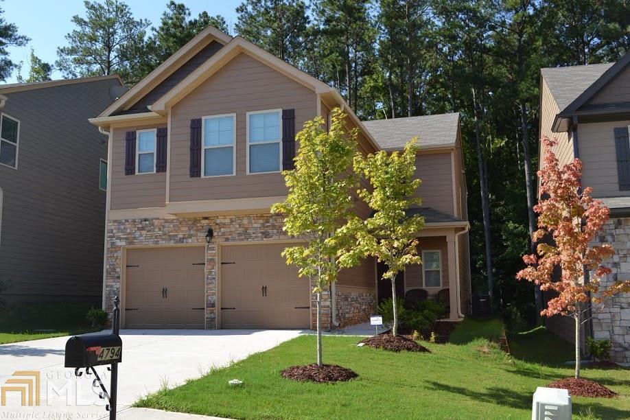 4794 Longview Run, Unit 61 Decatur, GA 30035 - Photo 1 of 1 a front view of a house with a yard and garage