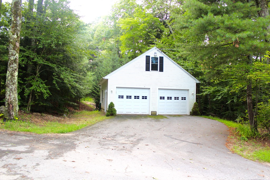 33 Hay Road Ashburnham, MA 01430 - Photo 4 of 17 a view of a house with a yard and large trees