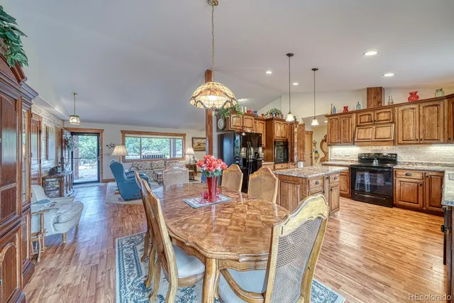 a view of a dining area with furniture window and wooden floor
