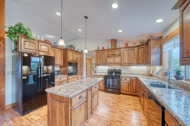 a kitchen with lots of counter top space and stainless steel appliances