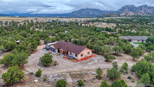an aerial view of a house with a garden