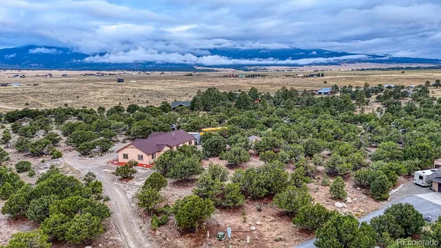 a view of a large building with lots of trees