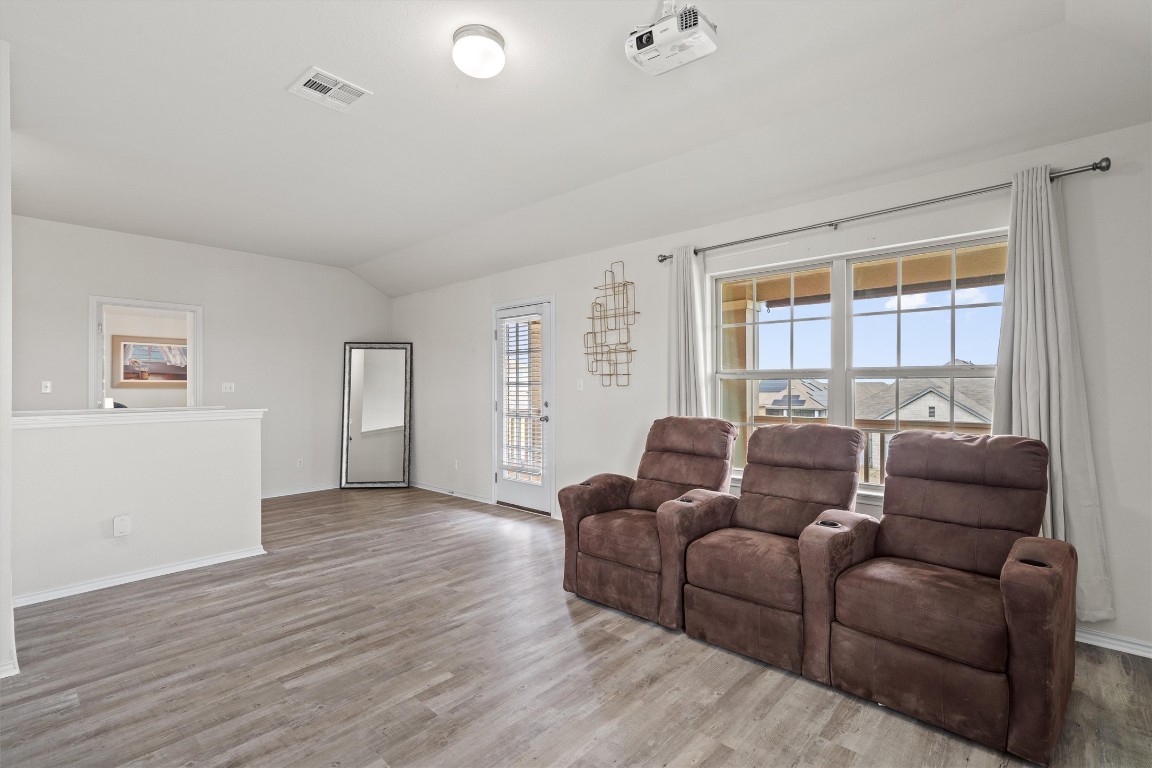 729 Coltrane Drive Pflugerville, TX 78660 - Photo 8 of 20 Upstairs game room with access to the balcony