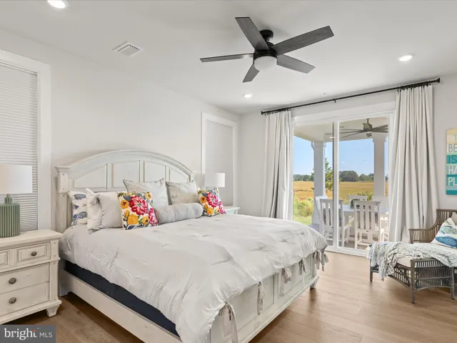 a bed room with a bed and a mirror