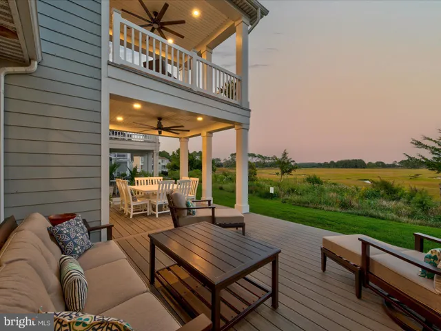 a view of a patio with a table and chairs