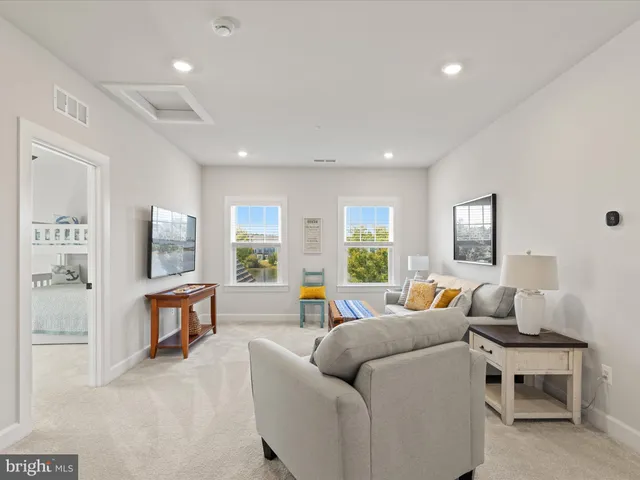 a bathroom with a sink toilet a mirror and shower