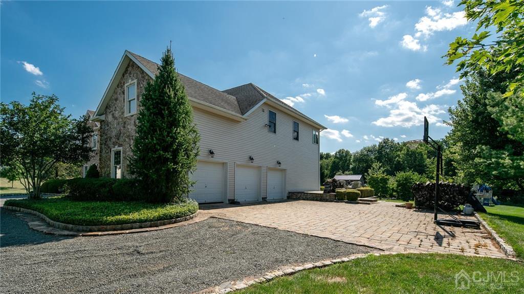 5 Daisy Court Skillman, NJ 08558 - Photo 13 of 50 a view of a house with a yard and potted plants