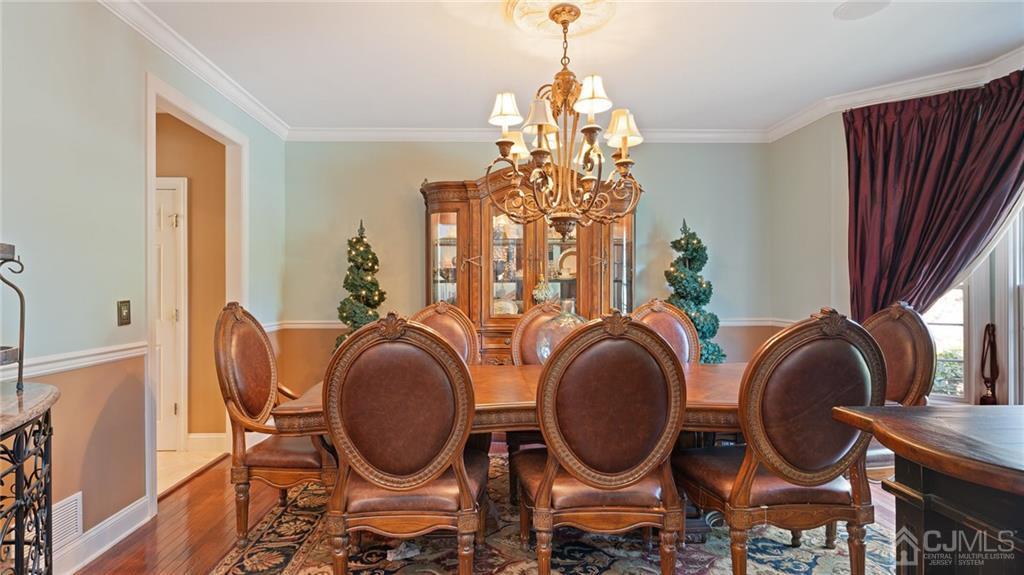5 Daisy Court Skillman, NJ 08558 - Photo 17 of 50 a dining room with chandelier fan and wooden floor