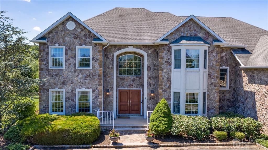 5 Daisy Court Skillman, NJ 08558 - Photo 2 of 50 a front view of a house with garden