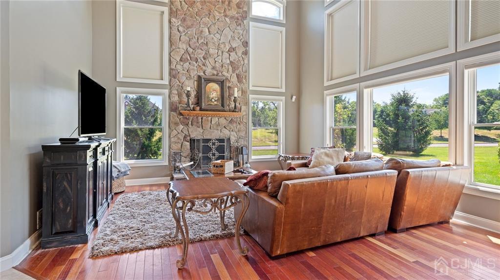 5 Daisy Court Skillman, NJ 08558 - Photo 25 of 50 a living room with fireplace furniture and a flat screen tv