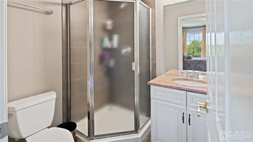 5 Daisy Court Skillman, NJ 08558 - Photo 32 of 50 a bathroom with a granite countertop shower a toilet and a sink