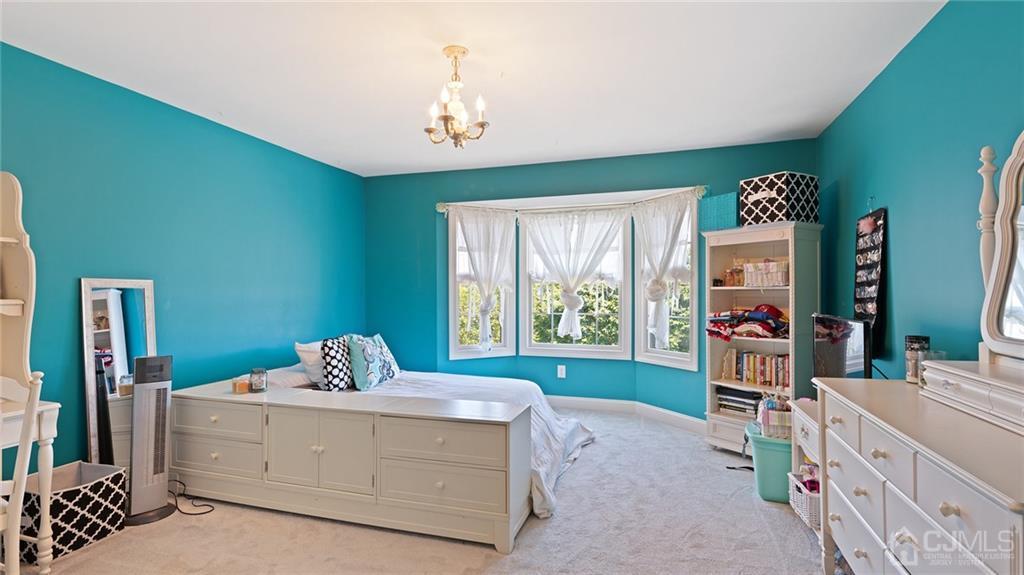 5 Daisy Court Skillman, NJ 08558 - Photo 33 of 50 a living room with furniture and a flat screen tv