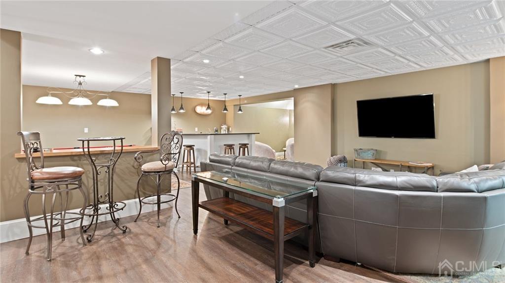 5 Daisy Court Skillman, NJ 08558 - Photo 42 of 50 a living room with furniture and a flat screen tv