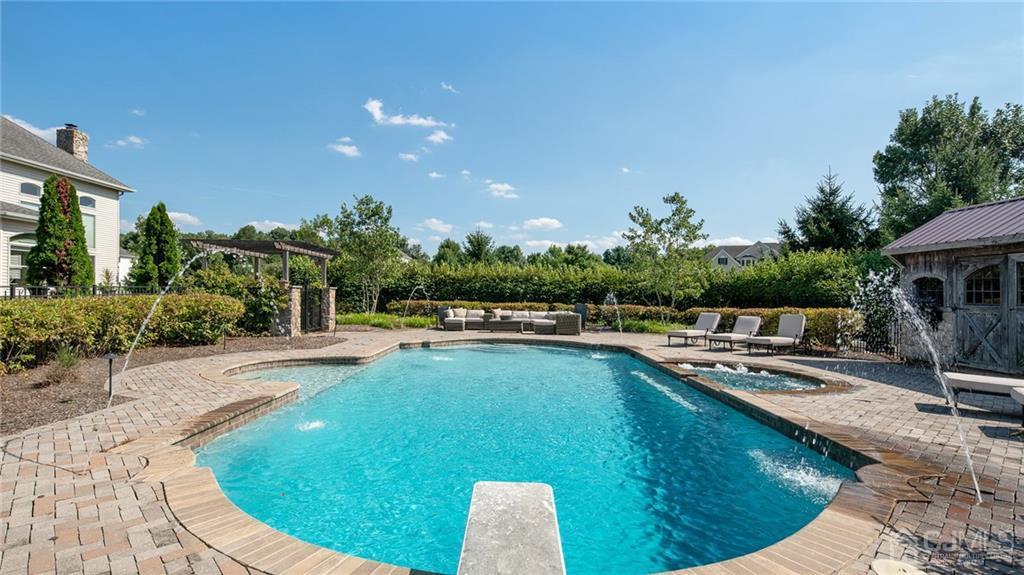 5 Daisy Court Skillman, NJ 08558 - Photo 10 of 50 a swimming pool with outdoor seating and yard