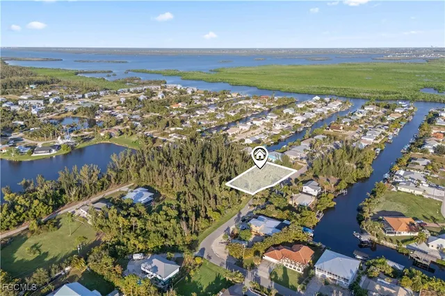 an aerial view of residential building and lake