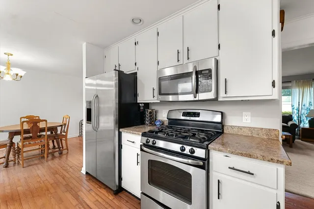 a kitchen with granite countertop a sink and a window