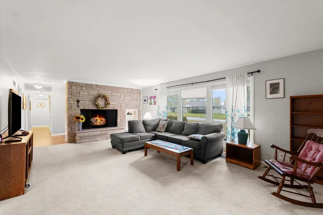 a living room with furniture and flat screen tv