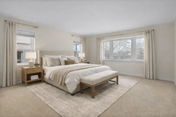 a bedroom with a bed and window