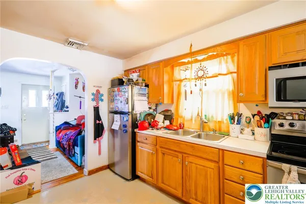 a view of a kitchen with utility and a sink