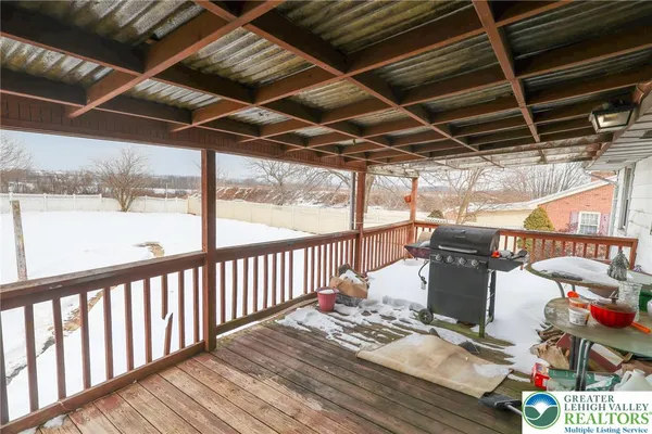 a view of balcony with wooden floor