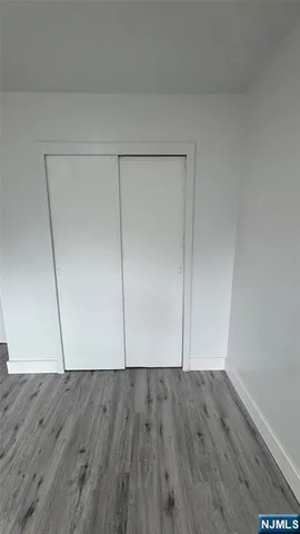 a view of room with hardwood floor