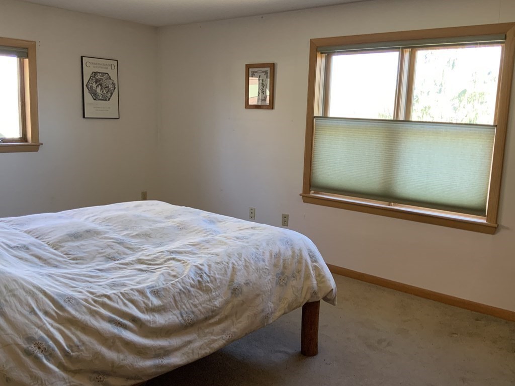 226 Hadley Road Sunderland, MA 01375 - Photo 21 of 37 a bedroom with a bed and a window