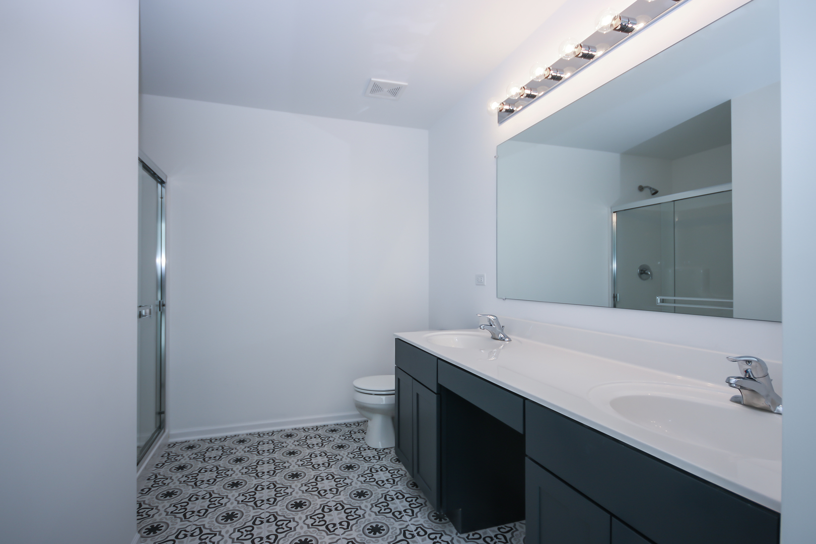 901 Willow Road Manteno, IL 60950 - Photo 11 of 17 a bathroom with a sink and a mirror