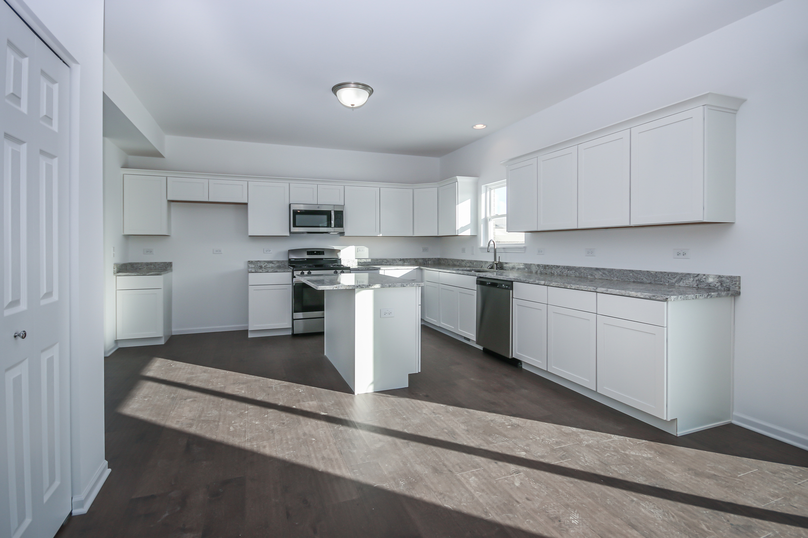 901 Willow Road Manteno, IL 60950 - Photo 2 of 17 a kitchen with stainless steel appliances granite countertop a stove a sink and a refrigerator