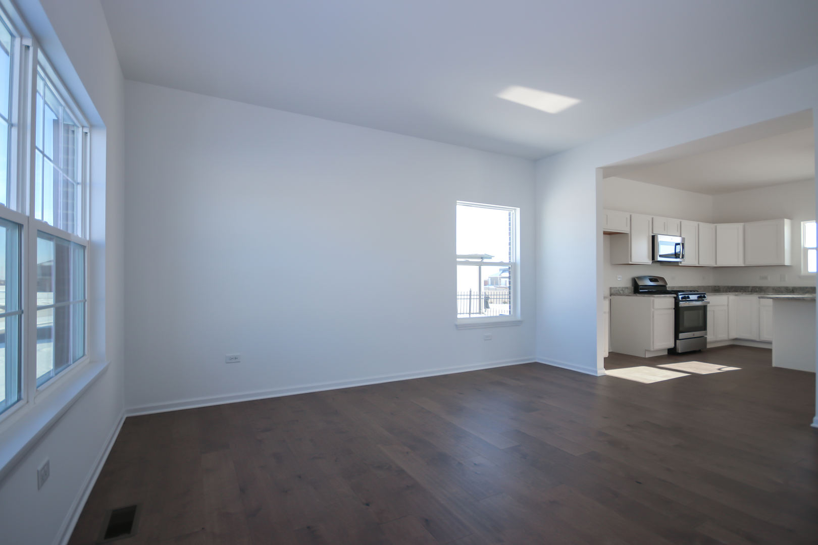 901 Willow Road Manteno, IL 60950 - Photo 6 of 17 a view of empty room with kitchen and window